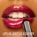 Close-up of a lip with a cherry-colored lipstick and text 'LIPS AS JUICY AS A CHERRY'.