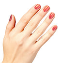 Hand with red nail polish on a white background