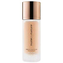 Foundation bottle with a gold cap on a white background