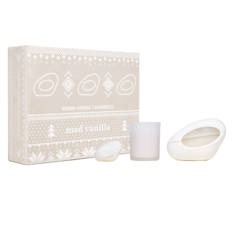 Set of candles with packaging labeled 'mad vanilla' on a white background