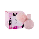 Pink perfume bottle with matching packaging on a white background