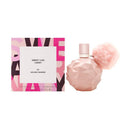 Perfume bottle and packaging with geometric design on a white background