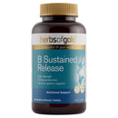 A bottle of Herbs of Gold B Sustained Release dietary supplement, featuring a dark amber bottle, gold cap, and a blue and white label.
