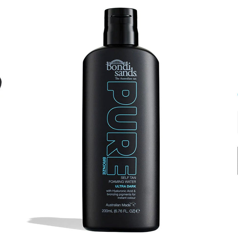 Black bottle of Bondi Sands Pure Bronze self-tan foaming water on a white background