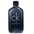Calvin Klein CK One Night Essence perfume bottle in a dark translucent smoky blue glass with a black cap, on a plain white background.