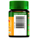 Vitamin bottle with green cap and label on a white background