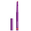 Covergirl lip balm stick with its cap off, showing the peach-colored balm tip and the metallic purple casing on a plain white background.