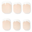 Six false press-on nails arranged in two rows of three on a white background. Each nail has a glossy nude-peach base with a white French tip and a thin line of silver glitter.