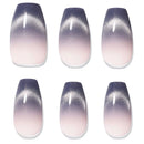 Six coffin-shaped press-on nails arranged in a 2x3 grid, featuring a gradient design that transitions from a dark purple glittery top to a soft pale pink at the tips, with a white accent line near the cuticle.