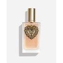 Perfume bottle with decorative heart-shaped cap on a light background