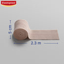 Roll of Elastoplast bandage with measurements on a gray background