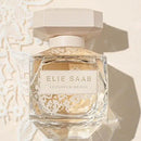 Elie Saab perfume bottle on a textured beige background