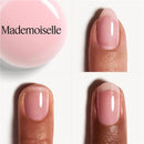 Pink nail polish on a white background with 'Mademoiselle' branding.