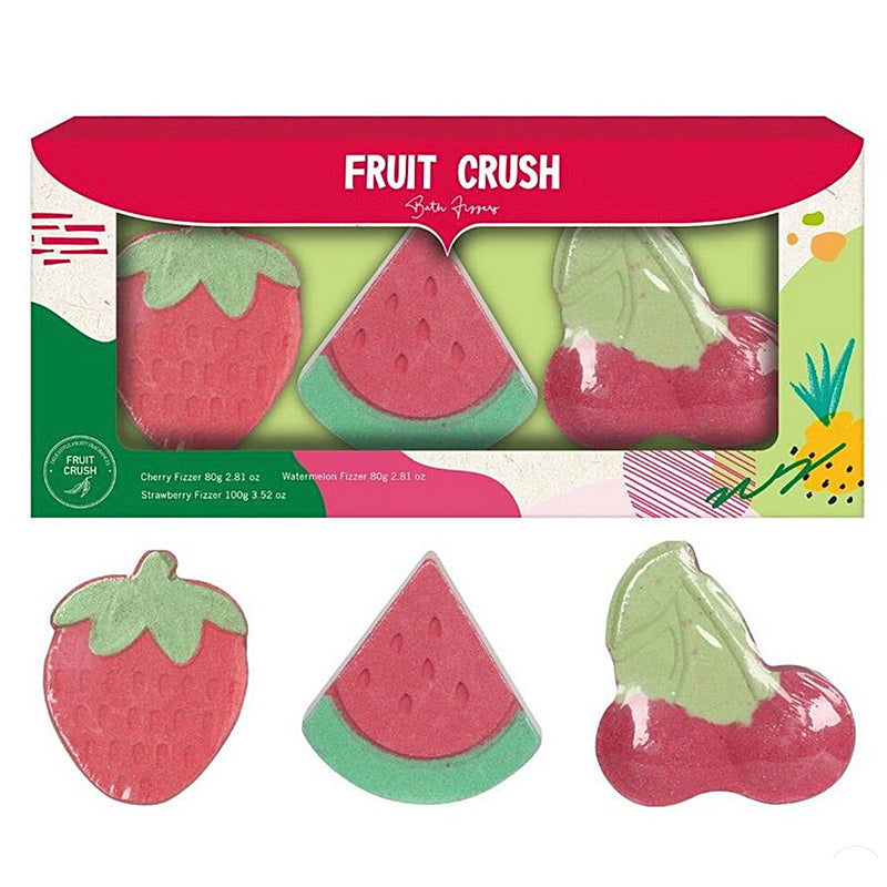 Fruit-shaped bath fizzes in packaging with 'Fruit Crush' branding.