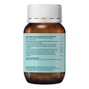 Bottle of herbal supplement with a white cap and green label on a white background