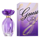 Guess Girl Belle Eau de Toilette spray bottle in purple glass next to its matching purple and gold packaging box on a white background.