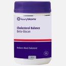 A white plastic jar of Henry Blooms Cholesterol Balance Beta-Glcan supplement with a purple lid and a purple and white label featuring a red stripe.