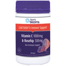 Vitamin supplement bottle with purple cap and label on a white background