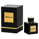 A black rectangular perfume box with a gold label reading 'SINGH EXTRAIT DE PARFUM' stands beside a matching black perfume bottle with a gold cap and gold front label on a white background.