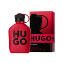 Red Hugo Boss perfume bottle and packaging on a white background