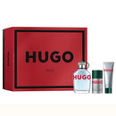 Hugo Boss perfume set with red box, white bottle, and green tube on a white background