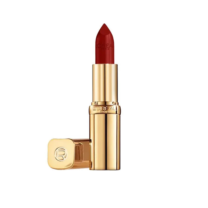 Red lipstick with gold casing on a white background