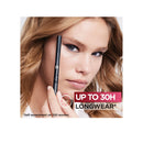 Woman holding a makeup product with 'Up to 30H Longwear' text on a white background