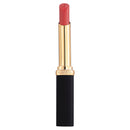 A photo of LéOreal Paris Colour Riche Intense Volume Matte Lipstick in the shade Coral Irreverent, showing the lipstick in a matte finish with a gold and black packaging.