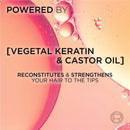 Product packaging with text about vegetal keratin and castor oil, set against a pink and orange gradient background.