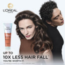 L'Oreal Paris Elvive shampoo bottle with a woman and man featuring healthy hair on a white background