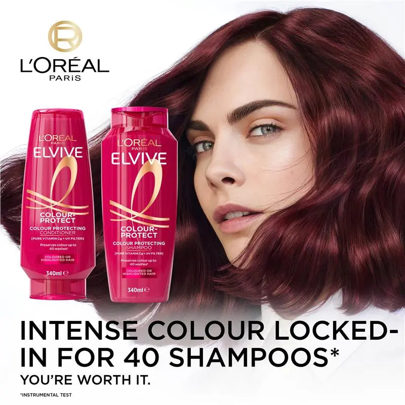 L'Oreal Elvive shampoo bottles with a woman with red hair, featuring the L'Oreal Paris logo.