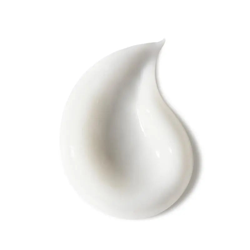Advertisement for a cosmetic product with marula and camellia oils on a beige background.