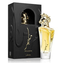 A bottle of Lattafa Maahir perfume with a gold horse-shaped cap, filled with golden-yellow liquid, standing next to its black presentation box with gold Arabic calligraphy and a horse illustration.