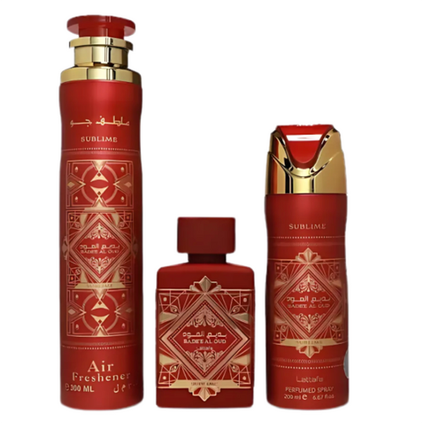 Set of red and gold perfume bottles with intricate designs on a white background