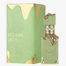 Eclaire perfume bottle and packaging with gold accents on a white background