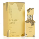Gold Eclaire perfume bottle and packaging on a white background