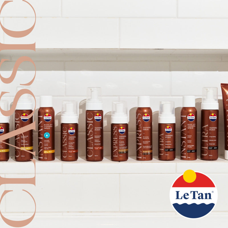 Row of Le Tan tanning products on a white tiled wall with the brand logo.
