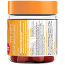 Jar of gummy vitamins with an orange lid and red gummies inside, on a white background.