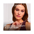 L'Oreal Paris advertisement with a woman holding a makeup product, featuring text about rich color intensity.