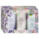 A gift set box containing three miniature body powder containers with floral designs on the labels, branded as Lulu Grace.