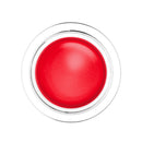 Red cream in a clear jar on a white background