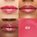 Close-up of lips with a pink lip color labeled 'HEAT' on a white background