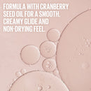 Bubbles on a pink background with text about cranberry seed oil.