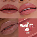 Close-up of lips wearing a pink lipstick with color swatch labeled '106 Maybe It's... Soft Satin'.