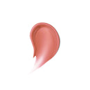 Nude-colored lip gloss swatch on a white background