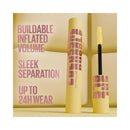 Mascara with yellow and pink packaging on a beige background