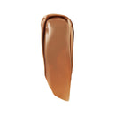 Beige cosmetic product swatch on a white background