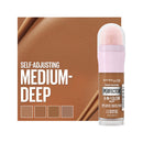 Maybelline Perfection 4-in-1 Glow makeup stick with packaging on a brown background