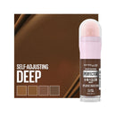 Maybelline Instant Age Rewind Perfection 4-in-1 Glow makeup stick with packaging on a brown background