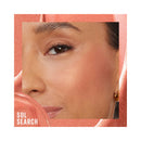 Close-up of a woman's face with makeup, featuring the brand 'SOL SEARCH'.